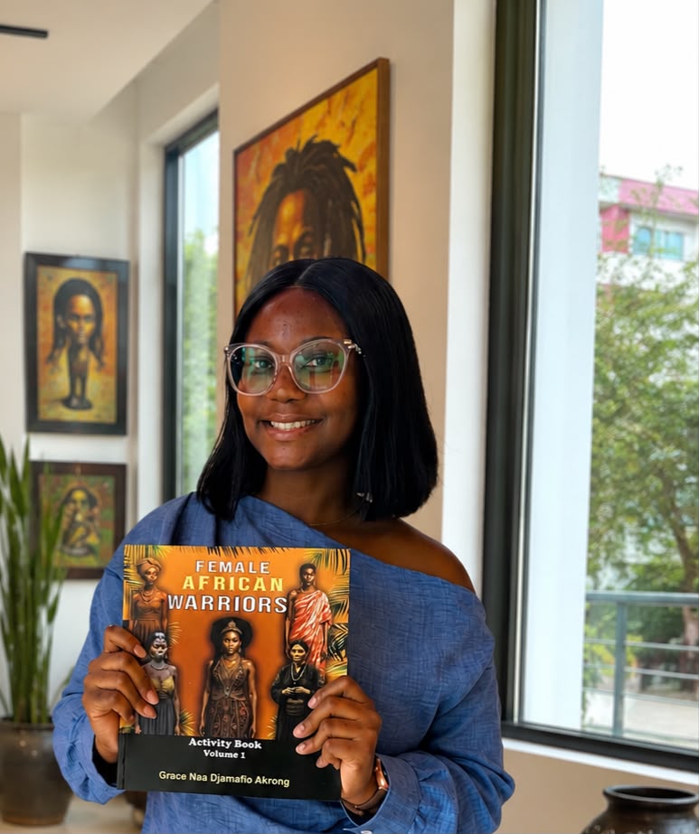 Grace holding Female African Warriors Activity Book